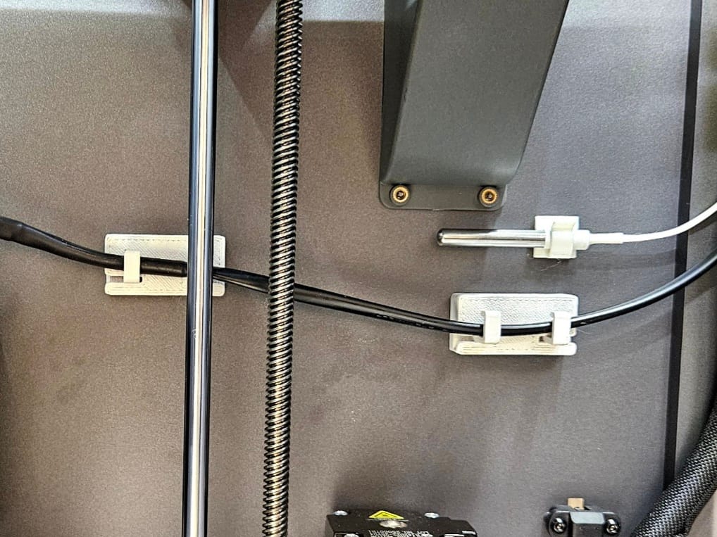 Cable mounts attached to the inside of the chamber